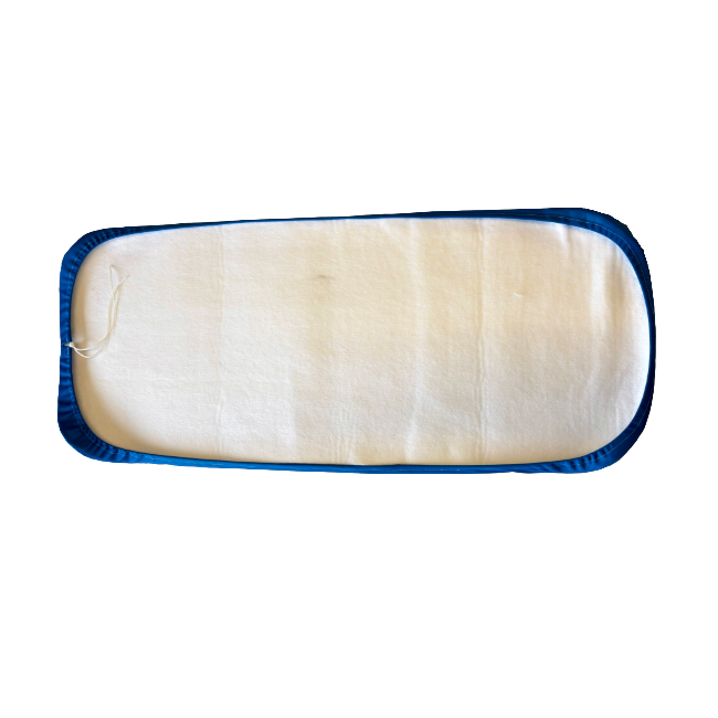 Rectangular cloth pad with blue border on a white background