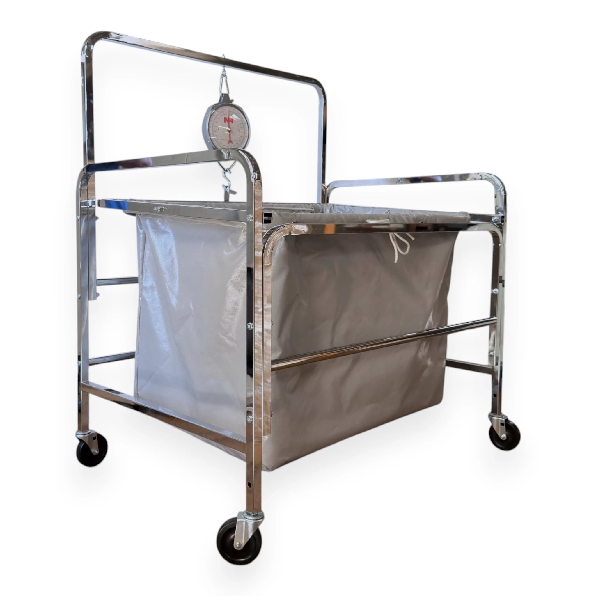 S70 industrial laundry scale left side view showing chrome tubular frame hand pull rails heavy duty vinyl liner and Newhouse dial scale head