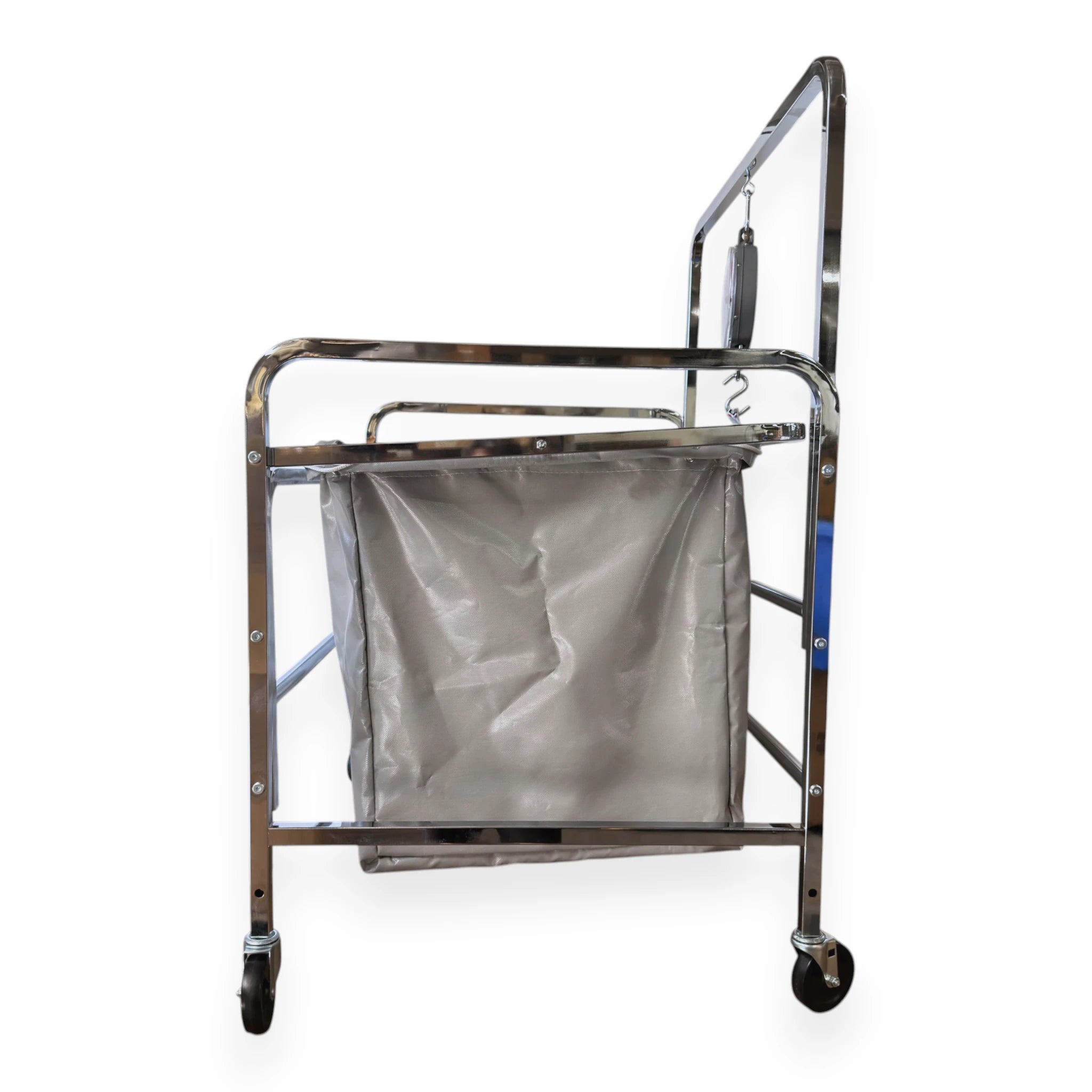 S70 industrial laundry scale side view showing chrome frame depth hand pull rail vinyl liner caster wheels and suspended dial scale head